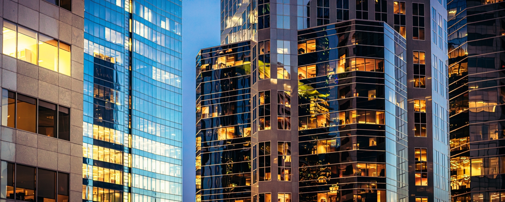 Modern glass offices at dusk